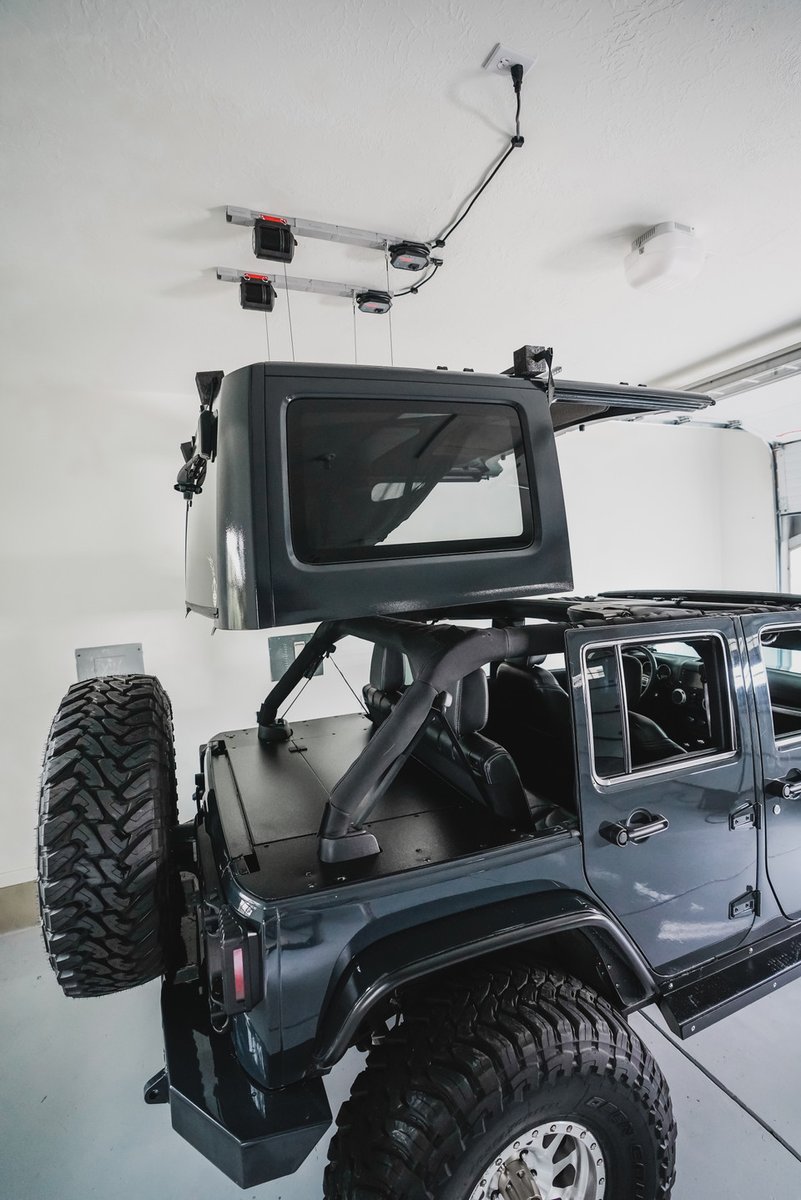 GarageSmartcom's tweet photo. Here's a riddle for you: which one of our products features soft-touch parts, an adjustable frame, lightweight components, and easy installation? Here's a hint: it makes removing your Jeep top a one-person job. Visit https://t.co/ej7y8nKlNz to shop the Hard Top Lifter now.⁠ https://t.co/ra3NO7Ji2j