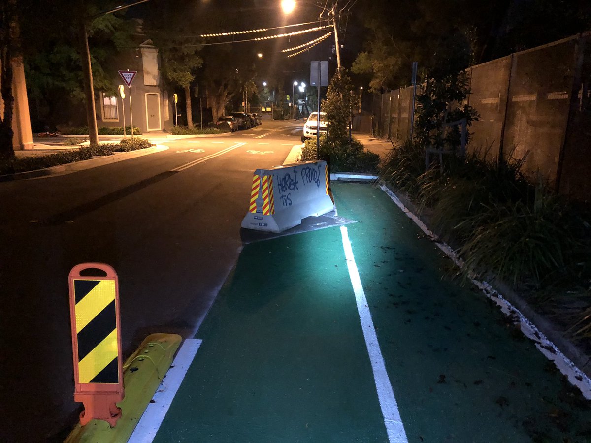 The western end of the Henderson Road/Bridge Street cycleway at Ashmore Street. This seems slightly unsafe to me, having a Jersey barrier sitting in the middle of the end of the southbound lane at the end of a very steep downhill grade(End of thread)