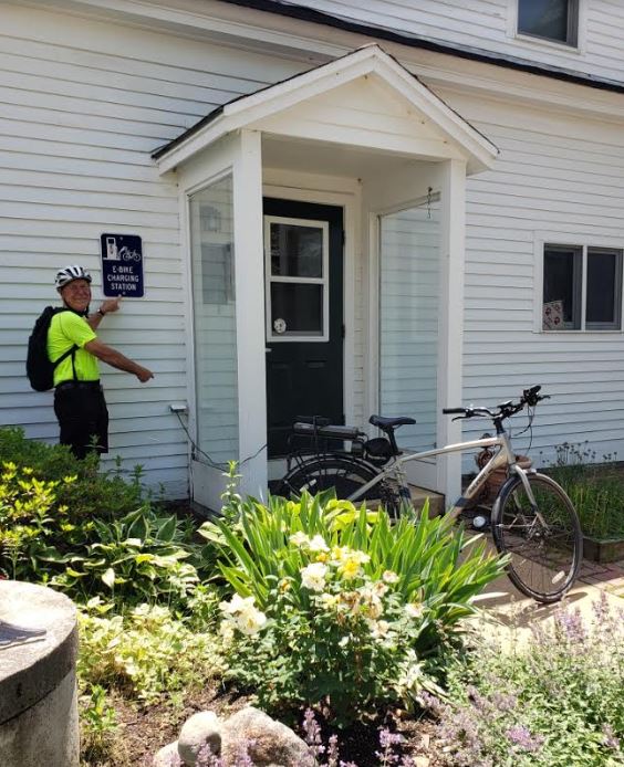 Our friend and heavy bicyclist, Alan Greenwood, modeled/post for the shot for the new e-bike Charging station at the Highland Lake Inn
