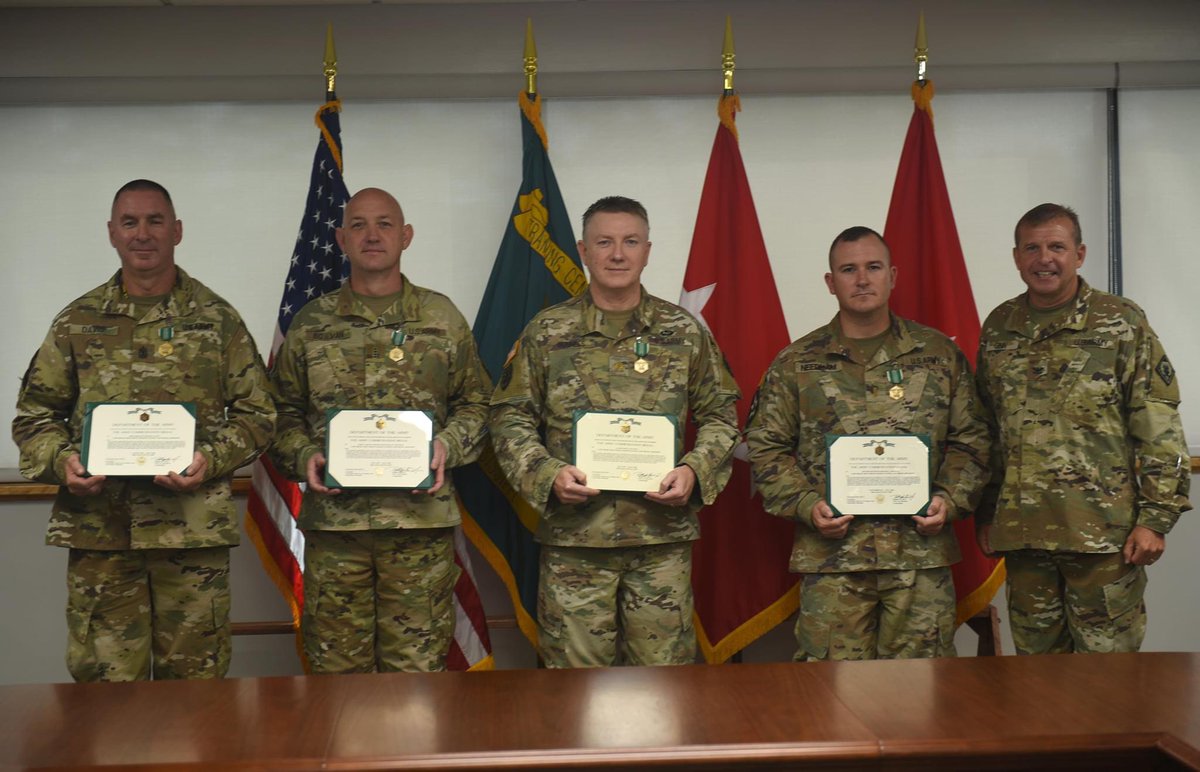 Col. Bobby M. Ginn, Camp Shelby post commander, awards the #armycommendationmedal to 1st. Sgt. Steven Davis, Chief Warrant Officer 4 Billy Bowman, Maj. James Runnels, and 2nd. Lt. Michael Needham. These four #soldiers were recognized for their outstanding #service.