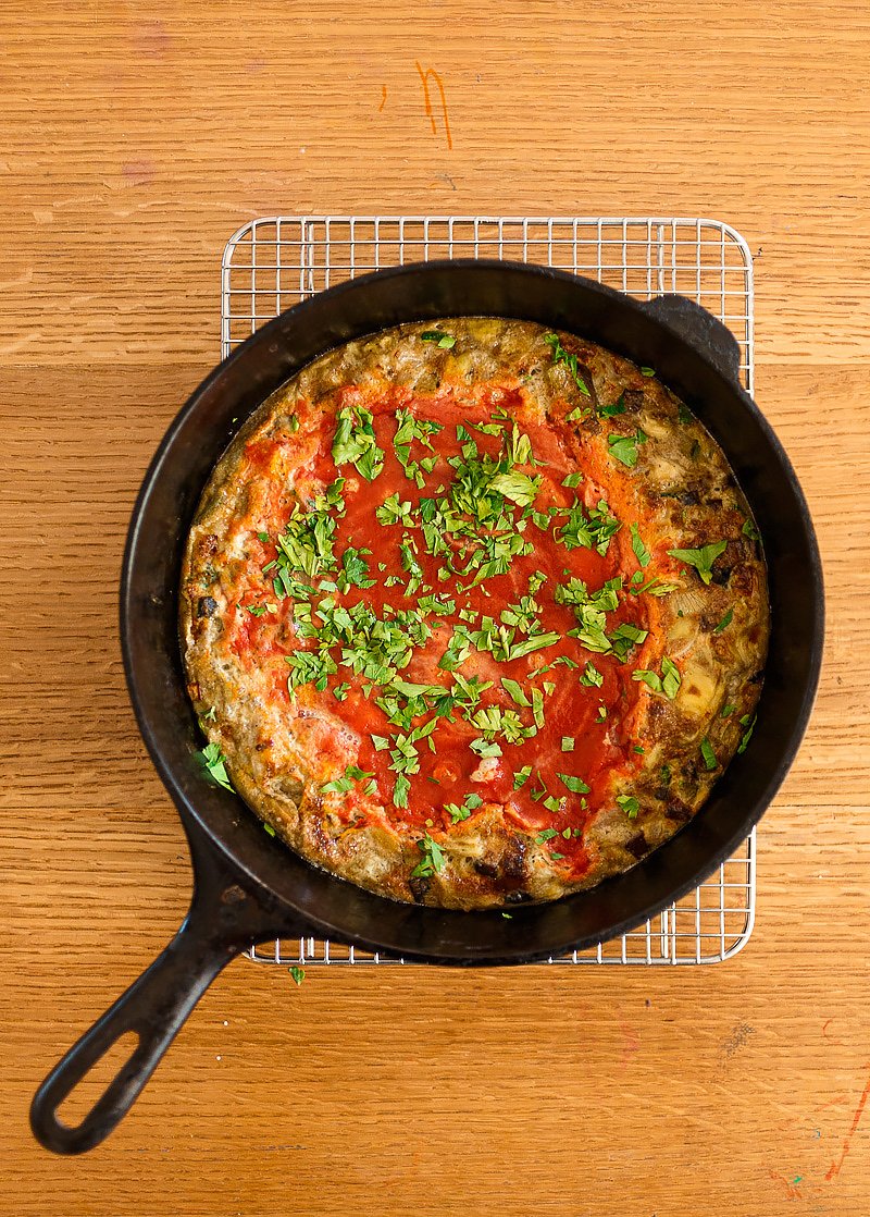 "Gram's Frittata" has a layer of tomato sauce gently spooned on top of it before baking, which sort of caramelizes as it cooks.