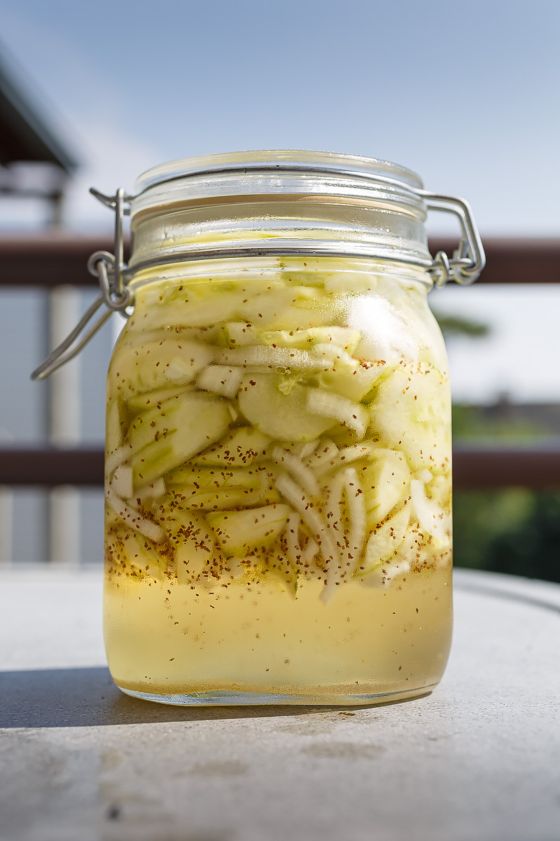 "Pickles and Onions" are salted, drained, then stored in what I now understand is a simple syrup made with vinegar instead of water, and some celery seed.