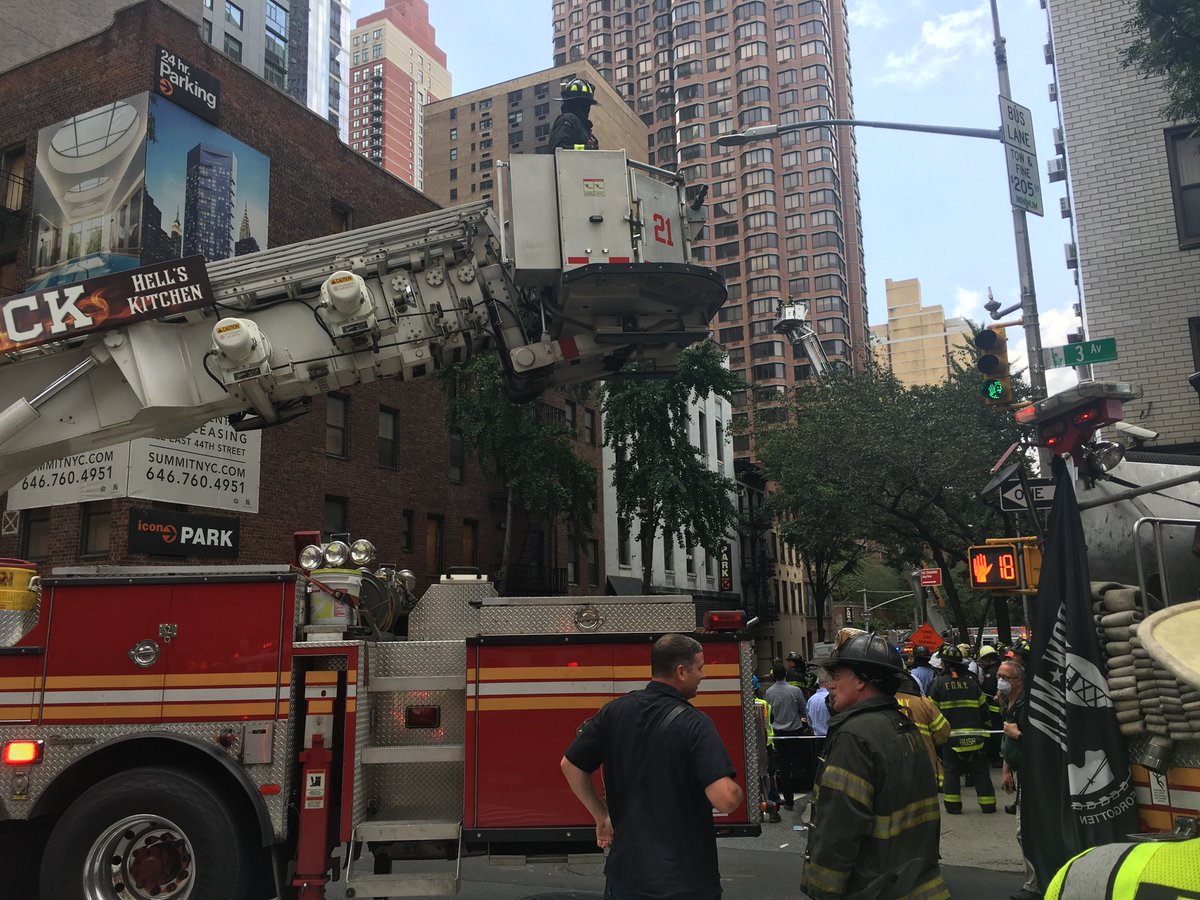 FDNY's tweet image. FDNY members continue to operate on scene of a partial parapet collapse from a 5-story building at 205 East 38 St. in Manhattan. There is currently one non-life-threatening injury to a civilian reported.