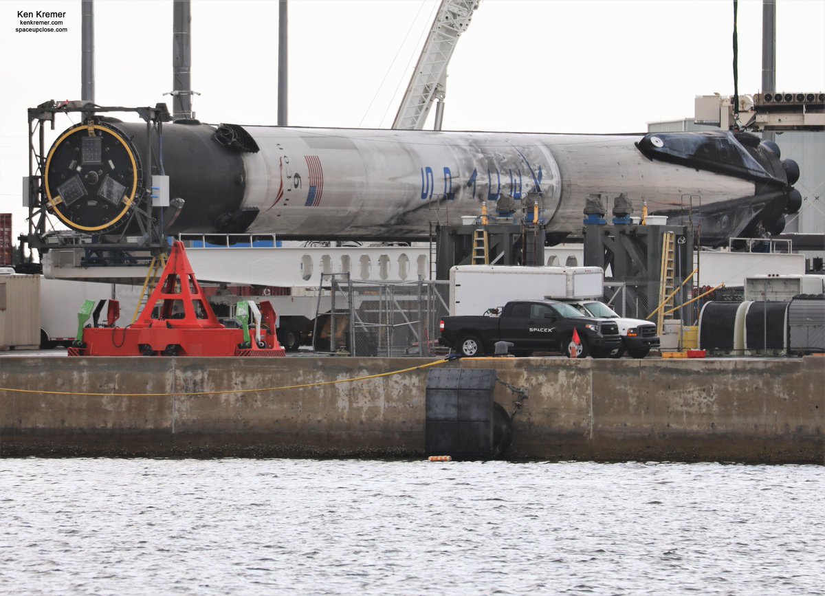 ken_kremer's tweet photo. With all legs retracted recovered #SpaceX #Falcon9 B1060.1 capped 1st stage from #GPSSV03 launch lowered horizontal and all work stopped @PortCanaveral-due to same atrocious weather that scrubbed todays planned noontime launch of next @SpaceX #Starlink from @NASAKennedy pad#39A https://t.co/IG7n6KV6a1