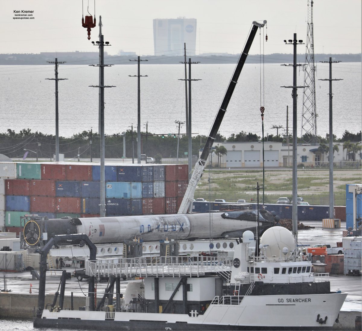 ken_kremer's tweet photo. With all legs retracted recovered #SpaceX #Falcon9 B1060.1 capped 1st stage from #GPSSV03 launch lowered horizontal and all work stopped @PortCanaveral-due to same atrocious weather that scrubbed todays planned noontime launch of next @SpaceX #Starlink from @NASAKennedy pad#39A https://t.co/IG7n6KV6a1