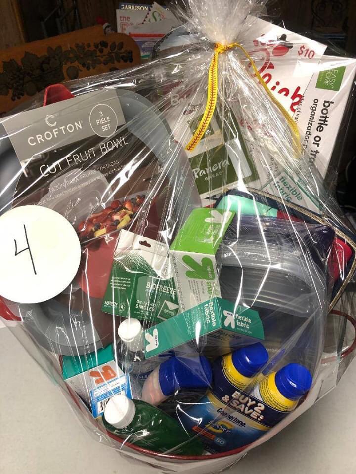 Basket #4: Travel Necessities: Cut fruit bowl; divided food storage containers; food storage containers; water bottle organizer; sunscreen; hand sanitizer; after sun cooling gel; first aid supplies; $25 Panera gift card; $15 Bob Evans gift card; $10 Chick Fil A gift card