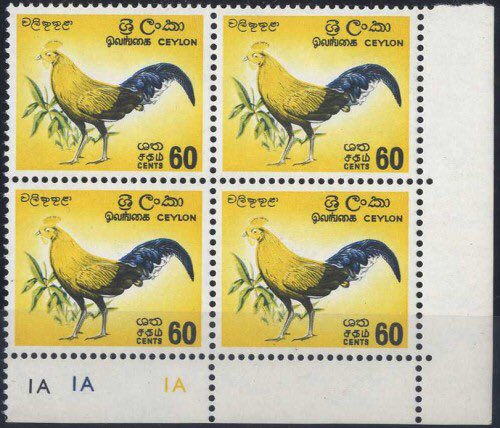 SpinkandSon's tweet photo. @Philatelovely #MissingColours Ceylon/Sri Lanka 1964-72 Junglefowl 60c. lower right corner block of four with plate numbers, each with red omitted. The missing red causes the majority of the junglefowl to appear in the yellow underlay colour 🙂 https://t.co/aRr8TKwjVM