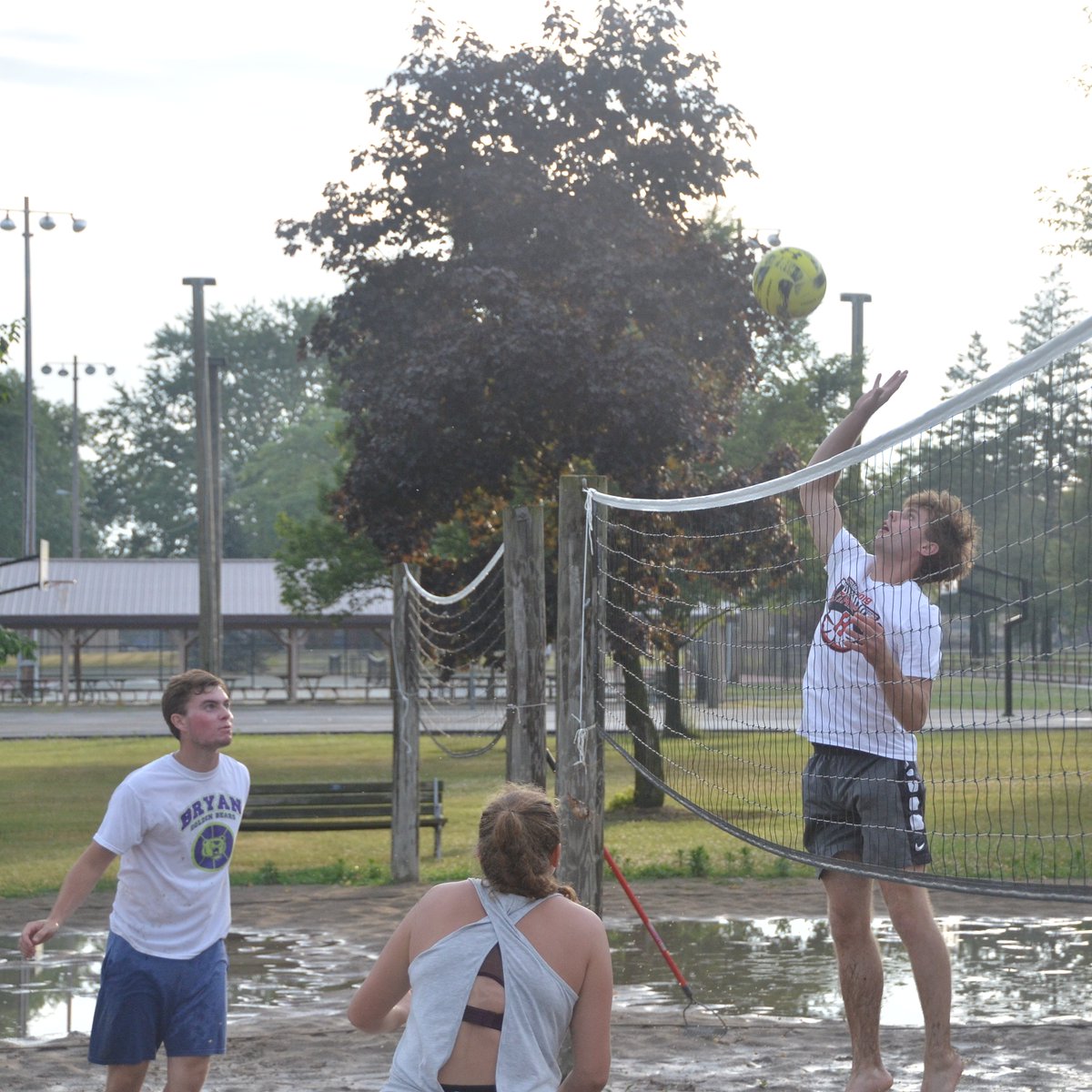 The baseball game I was supposed to cover tonight got canceled, but then I stumbled across some kids playing volleyball in a mud pit.