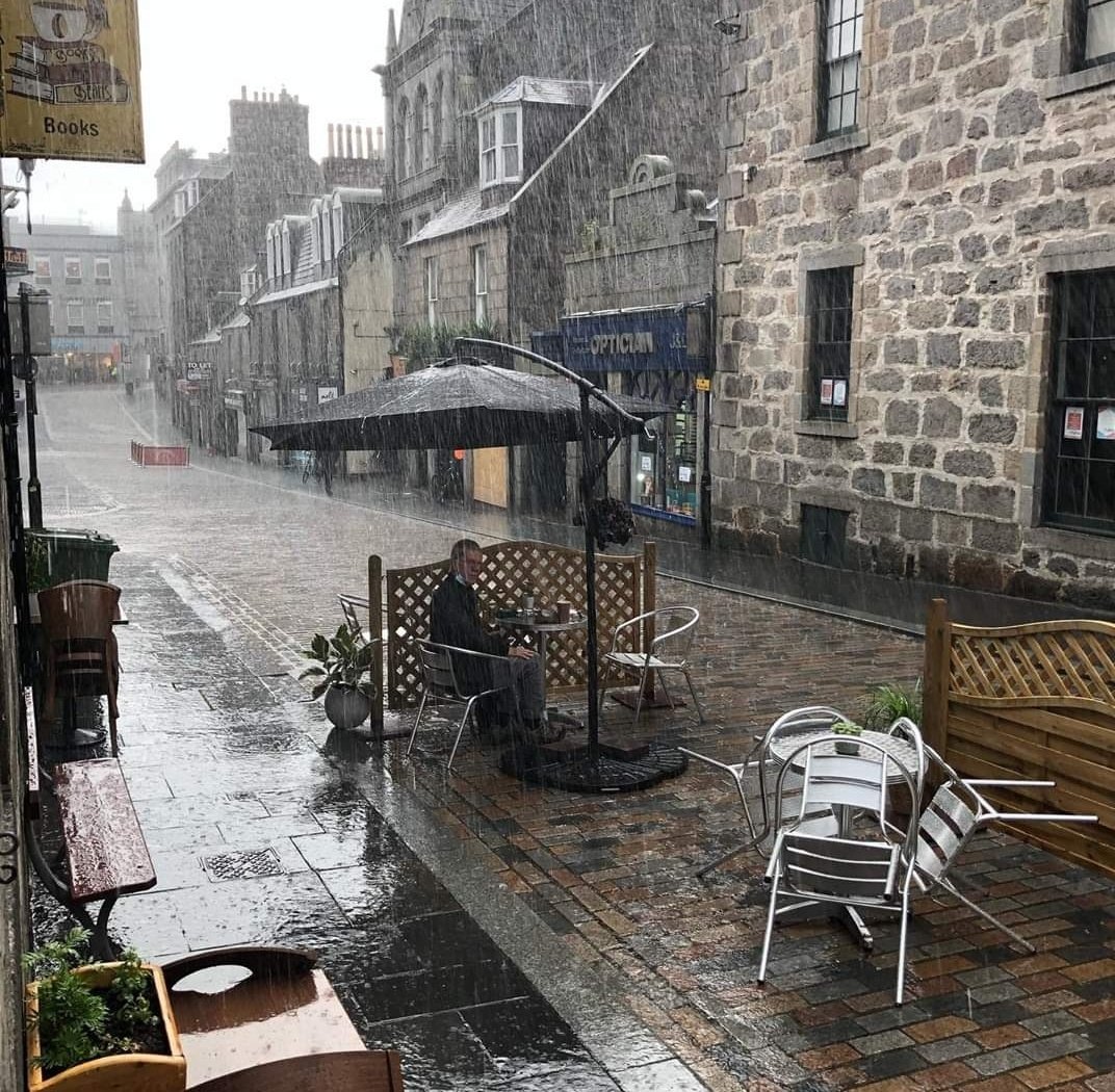 The most Aberdonian photo I think I've ever seen - there's so much optimism here, and it's unspoilt by the rain! C/o <a href="/Books_and_Beans/">Books and Beans</a> - Aberdeen's best wee independent coffee shop ❤️ #SupportLocal