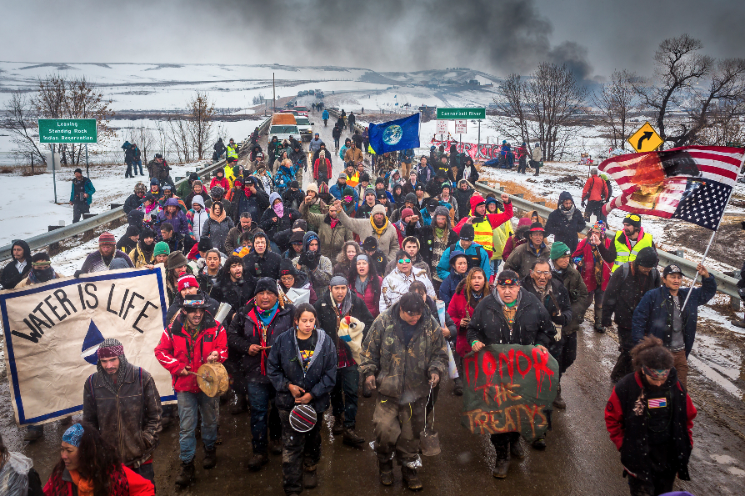 RollingStone's tweet photo. The story of the Dakota Access Pipeline is as damning a tale as any told about the crooked dealings of the colonists and capitalists who swindled this continent away from its First Peoples https://t.co/qIYp317kZW https://t.co/xPCD18gDBT