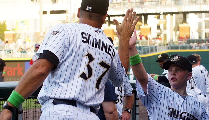 Eli received a number of high fives on that special day. Here's one from  @KnightsBaseball manager Joel Skinner.