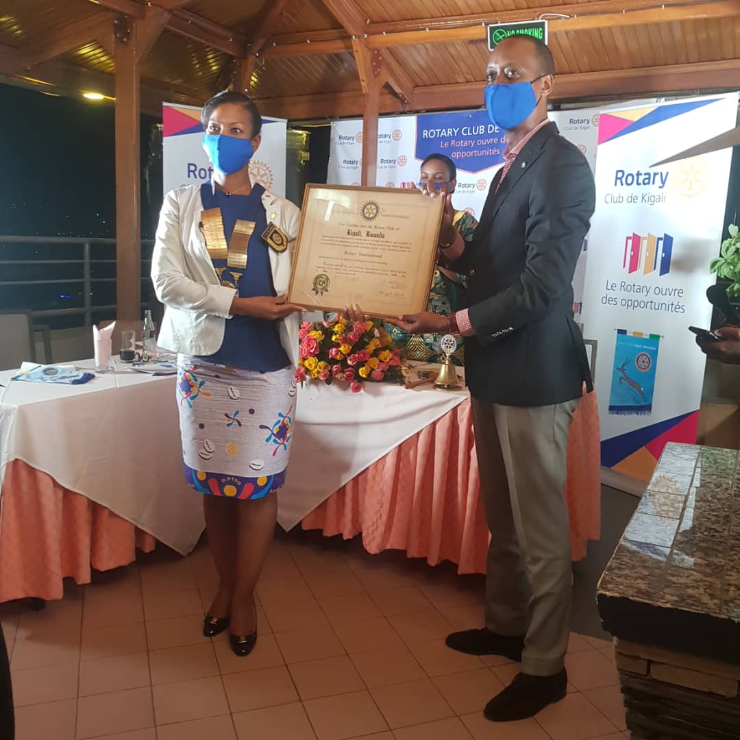 rckigali's tweet photo. IPP @EddySebera decorating President @SarahDoukoure with the Presidential medal as he receives a token of appreciation for his hard work, dedication & commitment to service.
#RCKDInstallation, #RotaryRwanda, #RotaryOpensOpportunities, #ServiceAboveSelf https://t.co/JiCaUIb66v