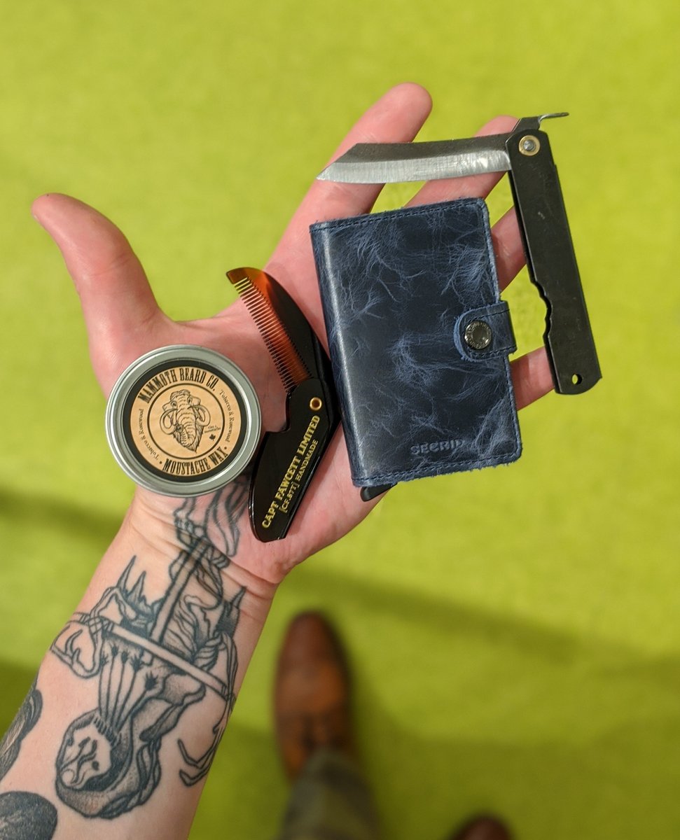 KentOfInglewood's tweet photo. What's in your pocket? Nathan can't live without some @mammothbeard 'stache Wax, a comb, his @secrid  wallet, and of course a pocket knife! In this case, a classic Japanese Higo.

You can find lots of great stuff to keep in your pocket at our shops, or at https://t.co/Z2ZtA21BG3 https://t.co/FqewrGarW7