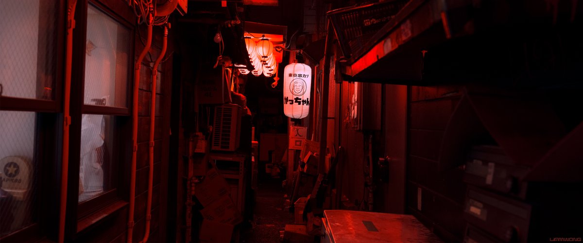 Photography by Liam Wong of Tokyo at night - focusing on simple shapes and color in architecture. This image is of a back alley lit in red with several white lanterns. 