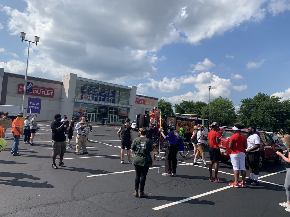 Small group gathered at a shopping plaza near the FOP Lodge prepared to protest against VP Mike Pence’s visit. There also some ominous tow trucks watching on the outskirts. The group is heading closer to the union lodge now, where a “Back the Blue” rally is also planned.