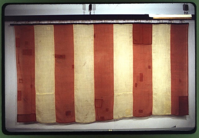 There was Sam Adams but there was also Isaiah Thomas, and Paul Revere, Patrick Henry, Samuel Chase, etc. Not only did they tear down statues, but they burned down law enforcement officers' houses.They had a flag, which is to this day on display at the Old State House in Boston.