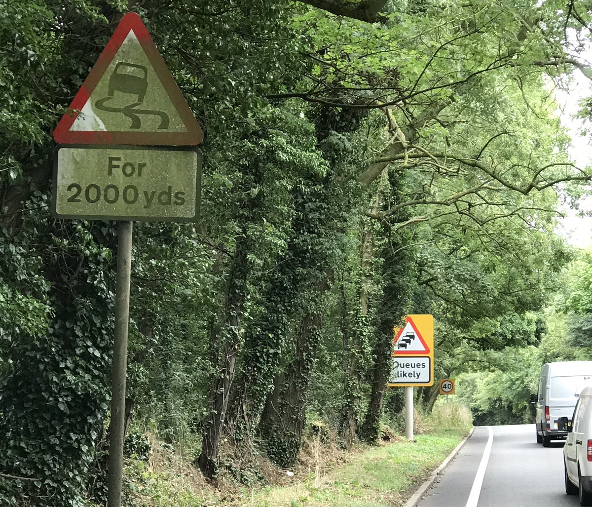 The A5 southbound into Hockliffe has a new queuing sign, installed by Highways England but it was completely hidden by trees!
Residents alerted me Monday and I immediately contacted HE.  I visited the site yesterday and to give them credit they did fix it quickly.