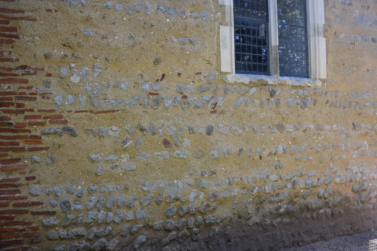 The red floor tiles in the brickwork are in fact earlier still and were recycled by Saxon builders from nearby ruined Roman structures, possibly even a villa. Some evidence of these buildings can still be found in local gardens.