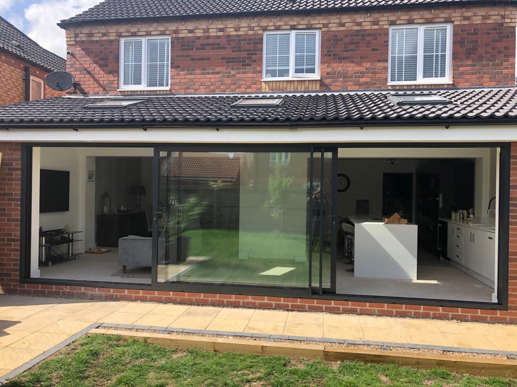 nott_win's tweet photo. Anthracite grey aluminium triple track sliding patio door installed in Long Eaton. For a free quotation call us on 01158 660066, visit https://t.co/xYsFES5G8H or pop into our West Bridgford showroom. #Nottingham #aluminium https://t.co/MByRpmPM4X