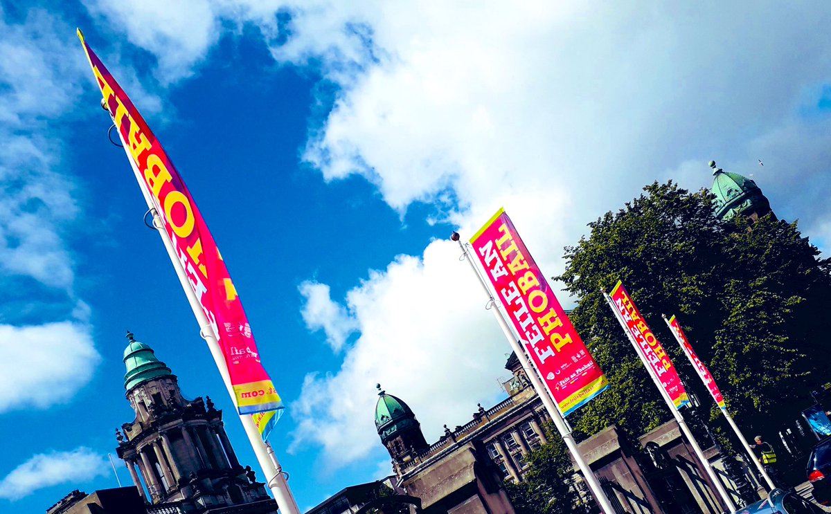 Féile an Phobail flags fly proudly at Belfast City Hall today. The flags of Ireland’s biggest community arts festival will fly at City Hall for the duration of Virtual Féile 2020 through to 9th August. We think they look fantastic!