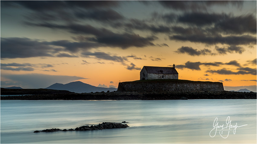 On a tiny island at the western fringes of Ynys Môn, encircled by the Irish Sea, in the silhouette of the mighty Wicklow Mountains, sits a landmark.A beacon to the heavens.A church in the sea.The simple, spellbinding St Cwyfan's.THREAD 