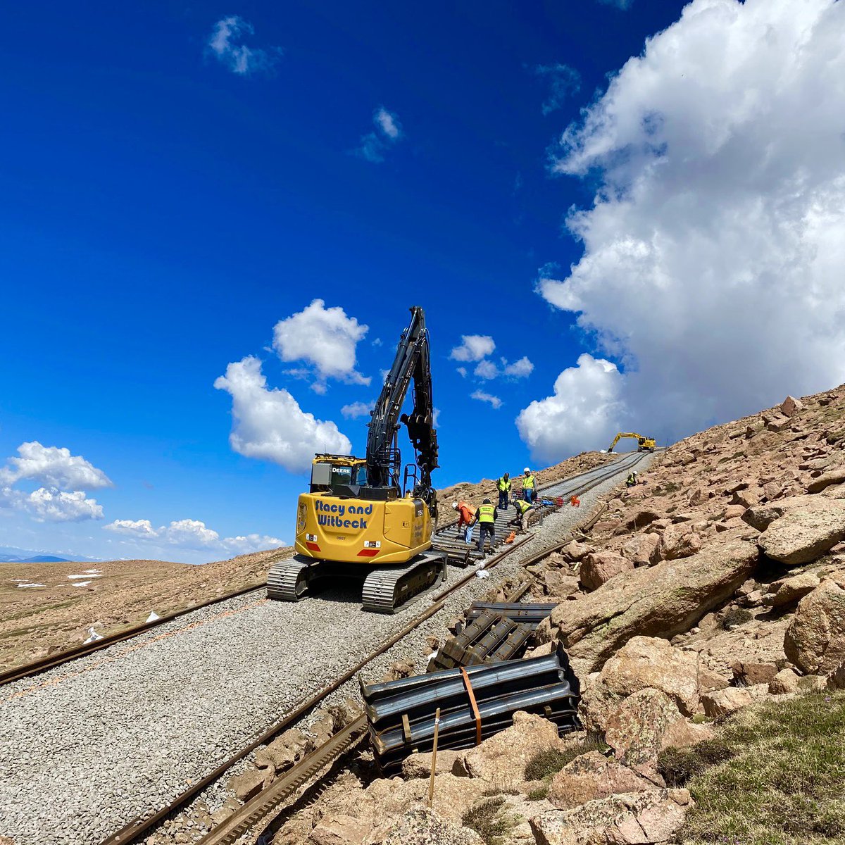StacyWitbeck's tweet photo. We can’t get enough of this view! The crews on Pikes Peak are hard at work rebuilding the Cog Railway, completing hundreds of feet of track daily. Way to go! Swipe for our favorite project shots.

#PikesPeak #AmericasMountain #WeBuildCoolStuff #StacyAndWitbeck #SWIBuilt https://t.co/fthmXM141f