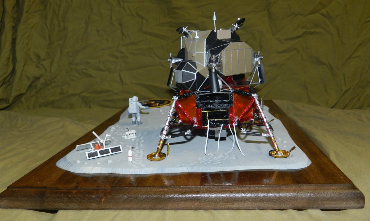 LM-5 was the first to have the lower struts and pads fully covered with thermal blankets. This change was made after the vehicle was stacked. The black box with white tapes was the Early Apollo Experiment Package housing that contained the various instruments seen.