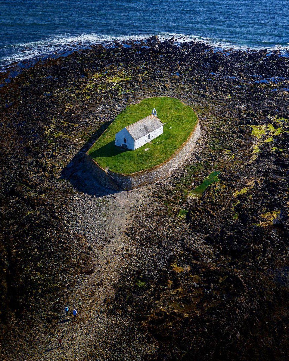 An intensely spiritual setting, the evocative St Cwyfan's Church – on the tidal island of Cribinau – can be reached on foot at low tide.More   https://www.anglesey-history.co.uk/places/churches_and_chapels/Llangwyfan/index.html  https://britishlistedbuildings.co.uk/300004382-church-of-st-cwyfan-tudweiliog#.XwiUAJNKjlw  https://www.buildingconservation.com/articles/limeworkstcwyfan/limeworkstcwyfan.htm