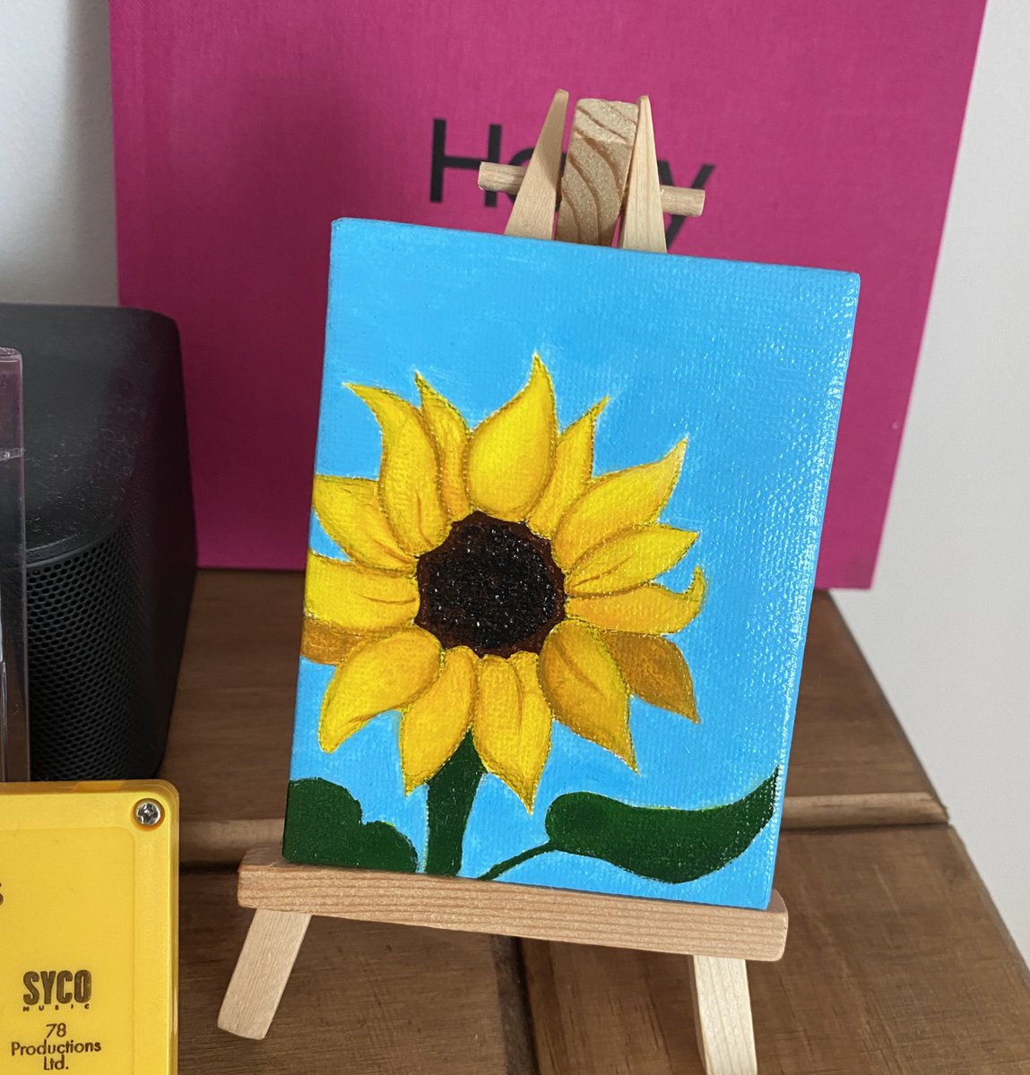 my shelf was hand made by my dad to display my favourite magazines, I added the tpwk stickers to the front and I added this print to the left later on, I have quite a few prints but this one on top of my drawers is my favourite and I also love this hand painted sunflower canvas