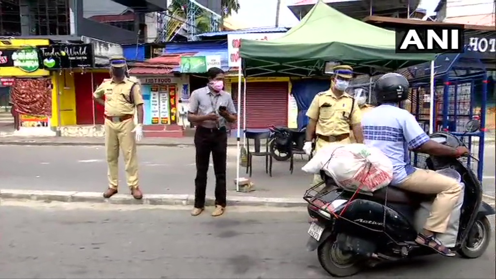 Kerala Police In Thiruvananthapuram Checks Ids Of People As They Move About For Their Daily 