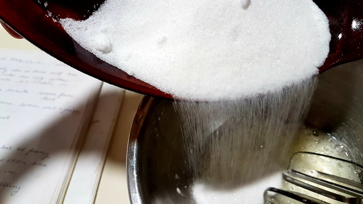 Now slowly add 6 tablespoons of sugar.