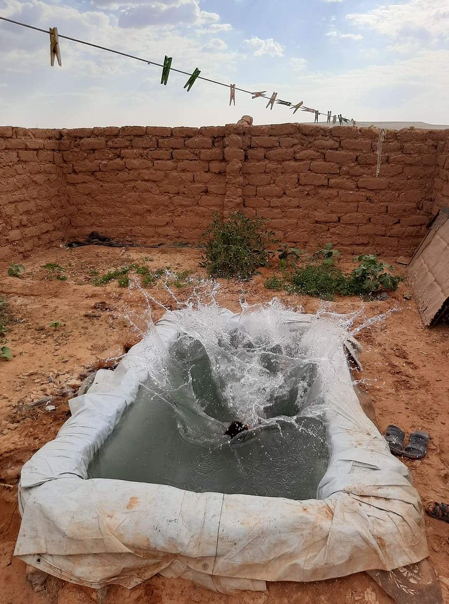 simonajeger's tweet photo. Kids in Al Rukban refugee camp built their own little swimming pool. - So terribly sad and hopeful at the same time. These children will never give up, no matter how much the world tries to ignore what hell they live in. #Rukban #Syria https://t.co/VC8Hyh2gyR
