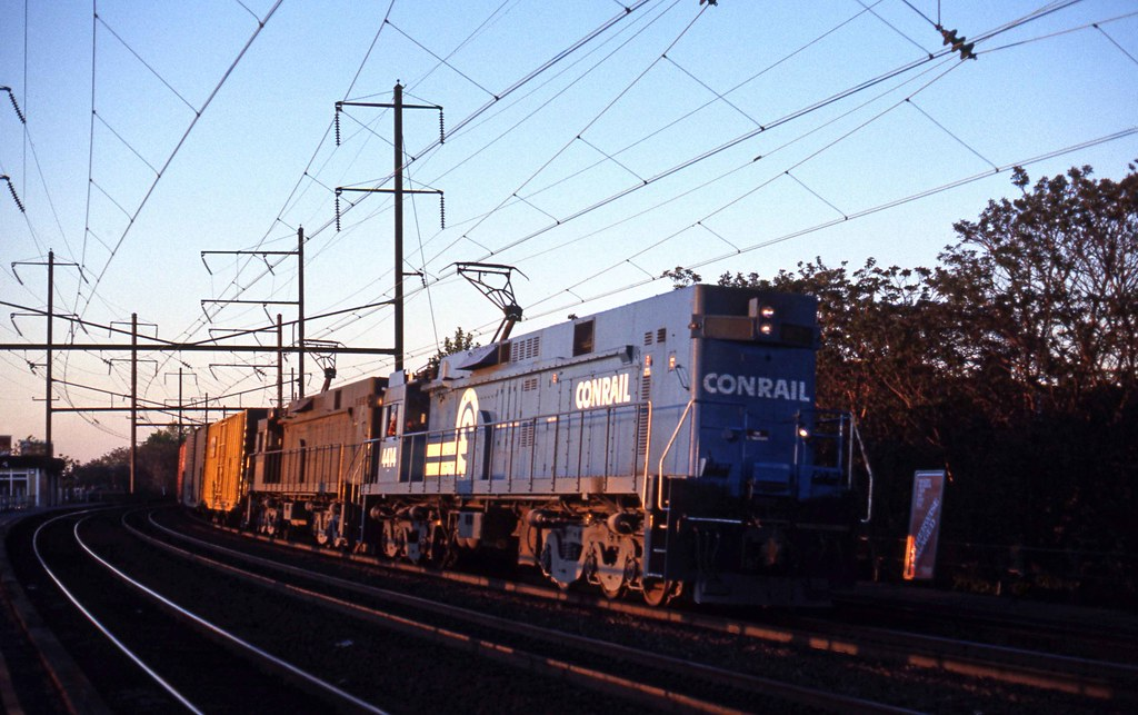 Conrail, not wanting to pay fees to NEC owners for freights on the corridor + recognizing the merit of separating passengers and freight, started shifting traffic away from the NEC. That spelled the end for electric freight trains, and began the yard saga. https://www.flickr.com/photos/5632/13750141144/