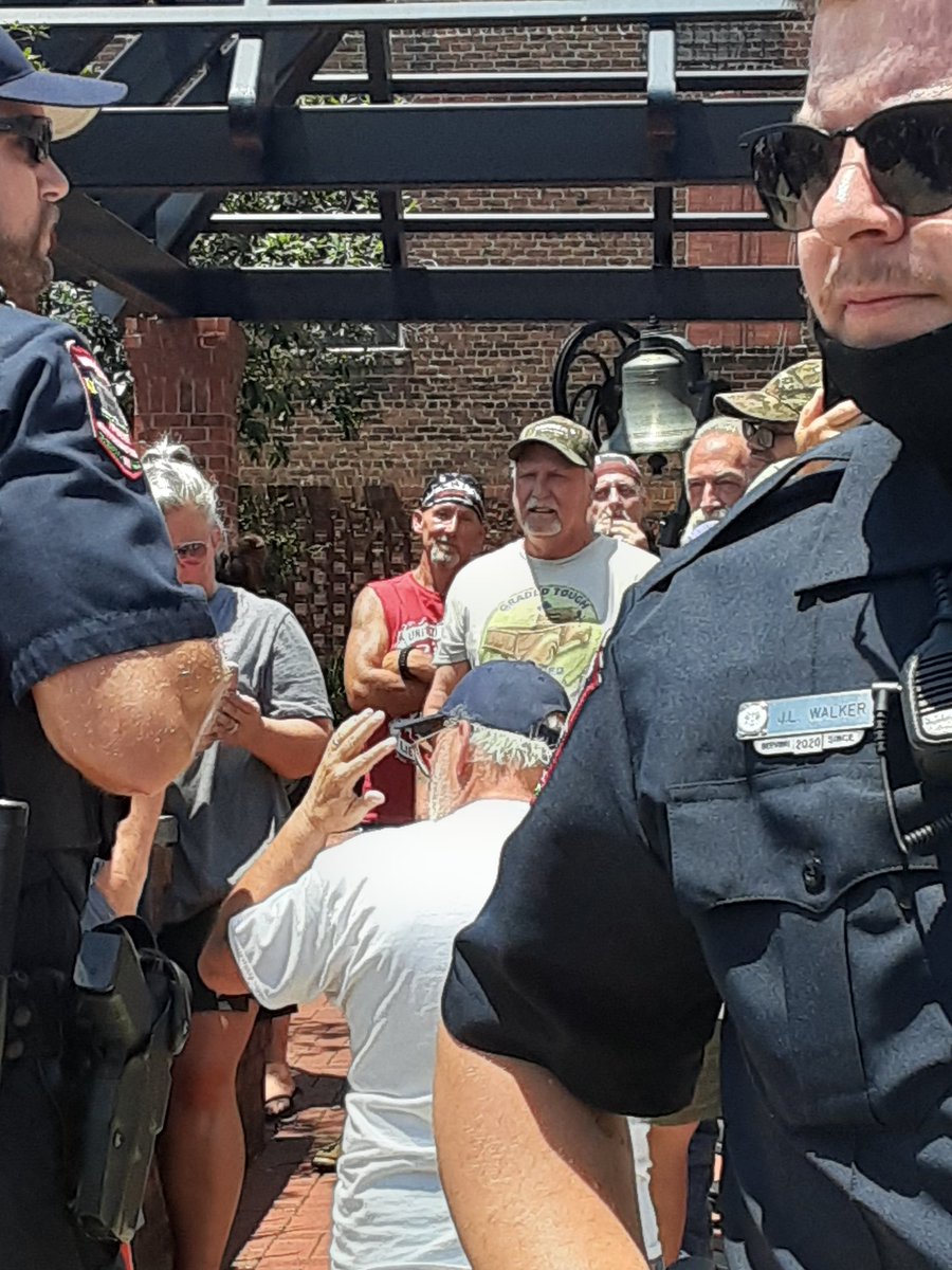 Nazi still hiding in the background. He appears to be friends with the person wearing a red "United We Ride" shirt. Can anyone fill me in on what group that is?