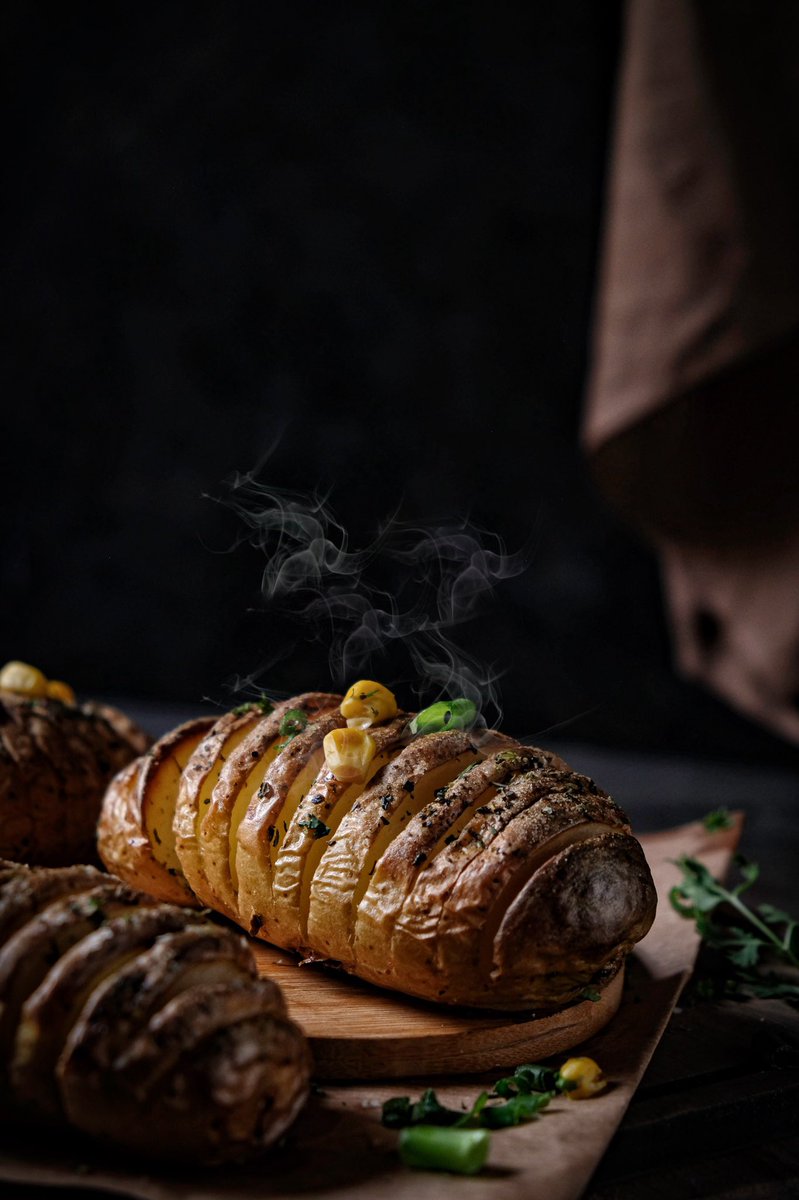 Hasselback Potatoes 🥔 
Do you know why they are called hasselback ones??? Hasselback potatoes got their name from the Swedish restaurant where they were invented and popularized. The restaurant was called Hasselbacken. 
#hasselback #potatoes #foodphotography