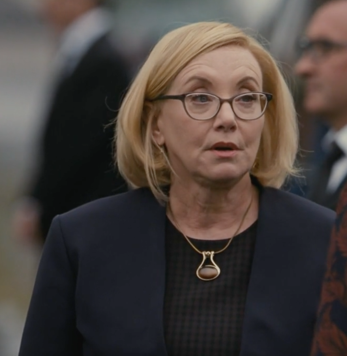 #32: Cool necklace! Interesting color mixing, black and blue, but she's a professional.