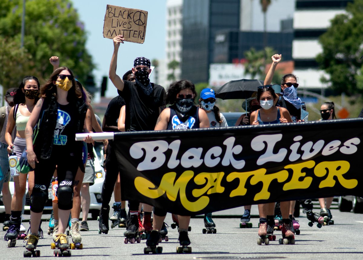 Dozens of skaters, bikers and activists ride down Ventura Boulevard toward the Sherman Oaks Galleria during a demonstration against racism and in support of Black Lives organized by  @ValleyChange on Saturday, July 11. (Eric Licas,  @ladailynews /  @SoCalNewsGroup )