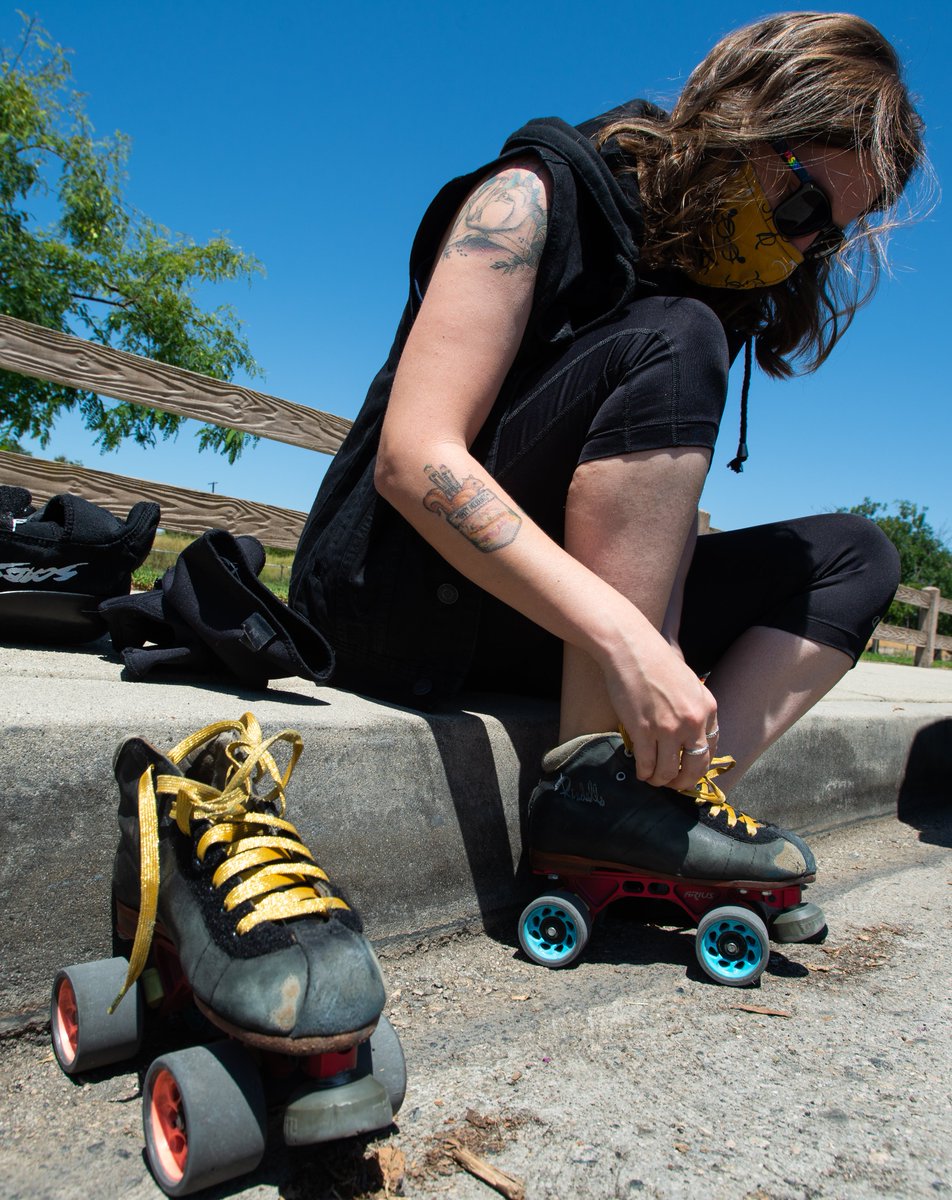  @SFVRollerDerby skater Ally Baldwin, 28, of Van Nuys, laces up at Libbit Park before a demonstration in support of Black Lives on Saturday, July 11. She said she's here because she believes sustained, persistent activism is necessary in order to bring about institutional changes.