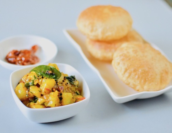 BurgundyBox's tweet photo. Is the Sunday not feeling like one, this is how we fix it. A plate of Poori Alu with Achar  and a cup of tea with the whole day to laze. 
Order your Sunday fix. call now or WhatsApp your order with Burgundy Box at 9833895320. https://t.co/3JrVOaoe2K
