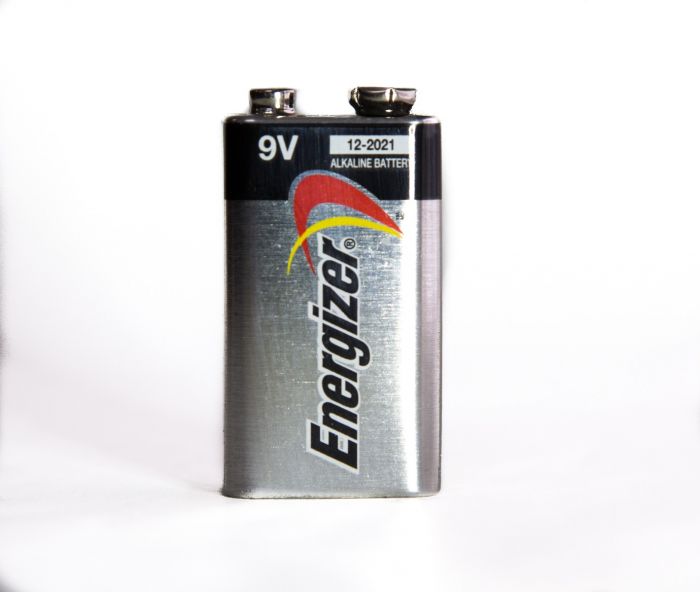 The detonator went into the plastic explosive.The two detonator wires were soldered to the hammer and catch of a mousetrap, and two more wires were soldered between the hammer and catch and the two terminals of a 9-volt battery.