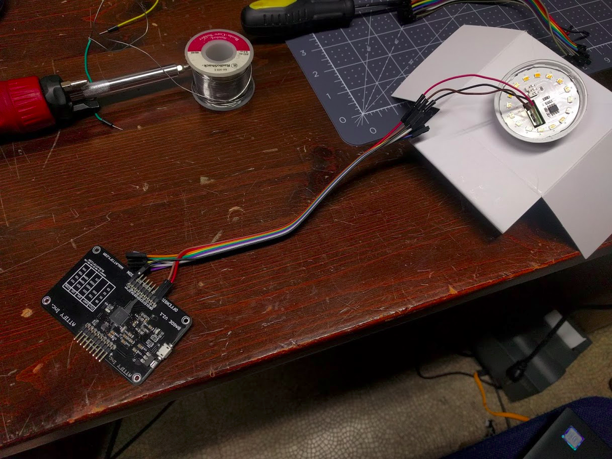 But hey, we're connected! And the Attify badge I got at DEFCON a few years ago comes in handy once again, I'm going to use it as my UART interface. Pin 0 to TX, 1 to RX, and ground to ground.