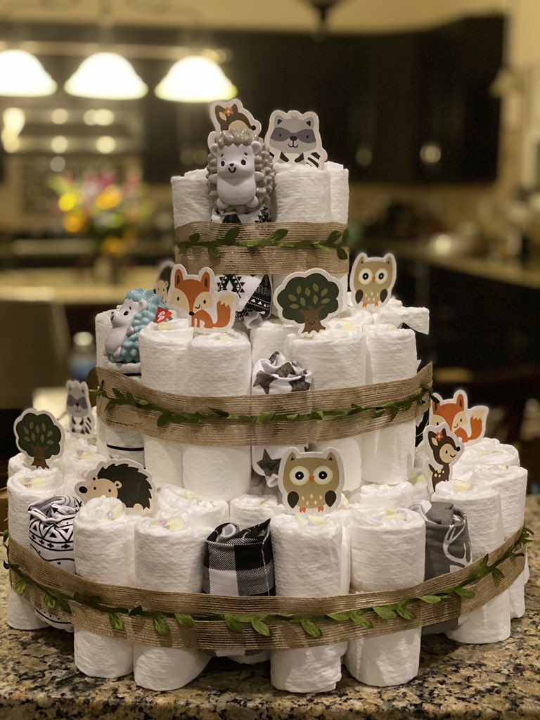 aureylian's tweet image. My friend isn’t able to have a baby shower due to COVID and she’s due in four weeks so I made her a diaper cake that has hidden gifts from her registry in it 🥰