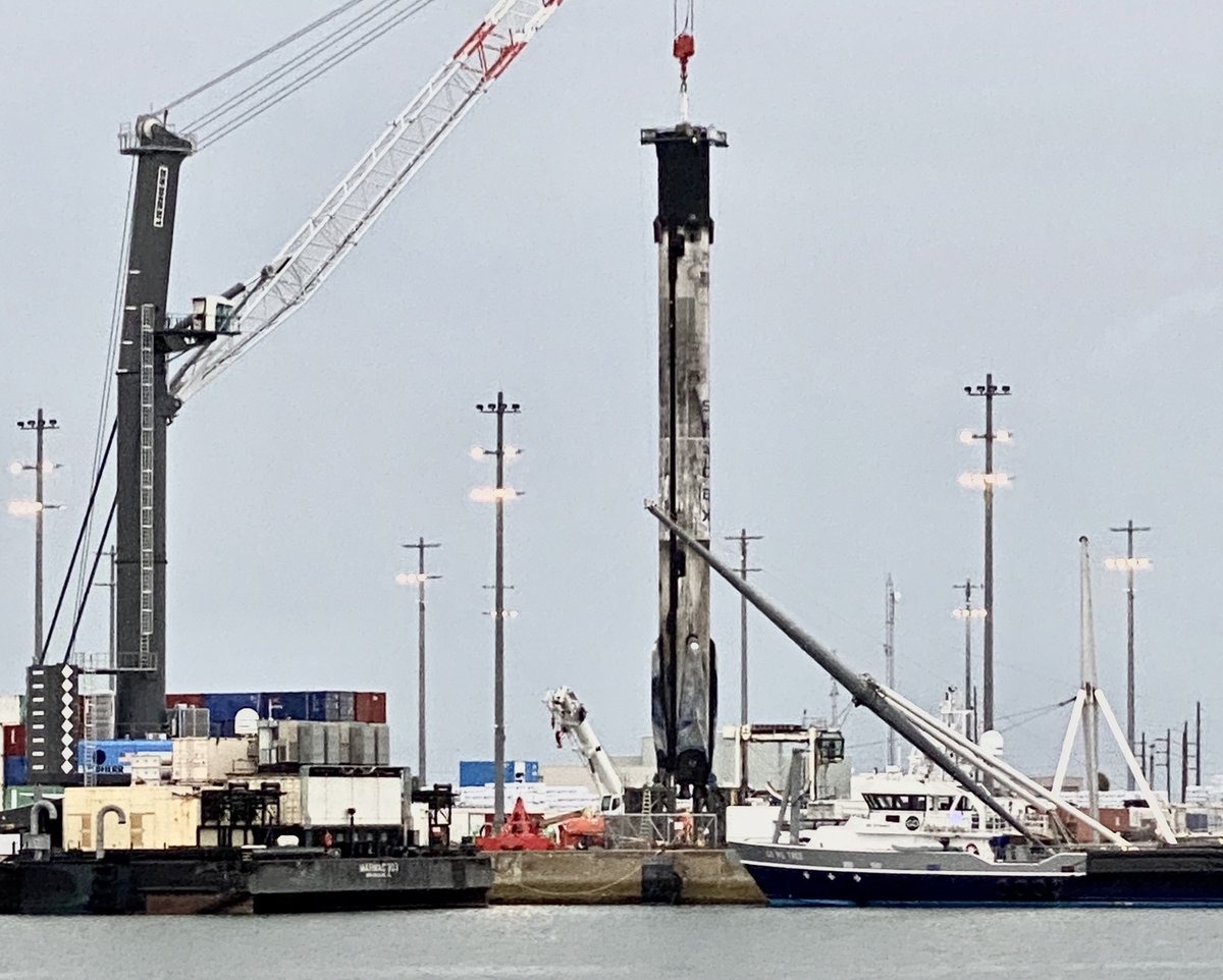 ken_kremer's tweet photo. Just stunning to see proud 2x launched/landed #falcon9 1st stage w all 4 legs retracted-under gloomy skies/torrential rain/thunder that halted work this afternoon @PortCanaveral.from #anasisII. This #spacex booster also 1st to launch humans from US in 9 yrs on its 1st flight https://t.co/bIiioE5EgI