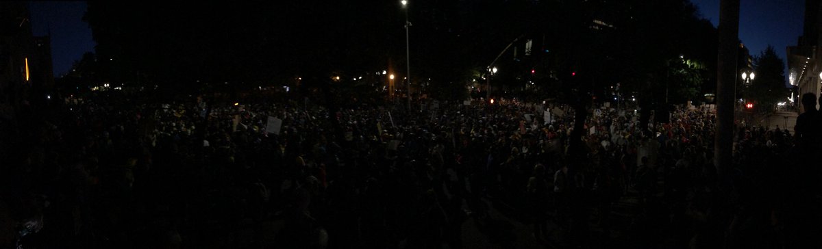 Anyone wanna try counting heads jk lol, my camera sux. Crowd chanting “Feds go home” on one side while a speaker gives a speech on the other side, and they don’t seem to be interfering with each other.