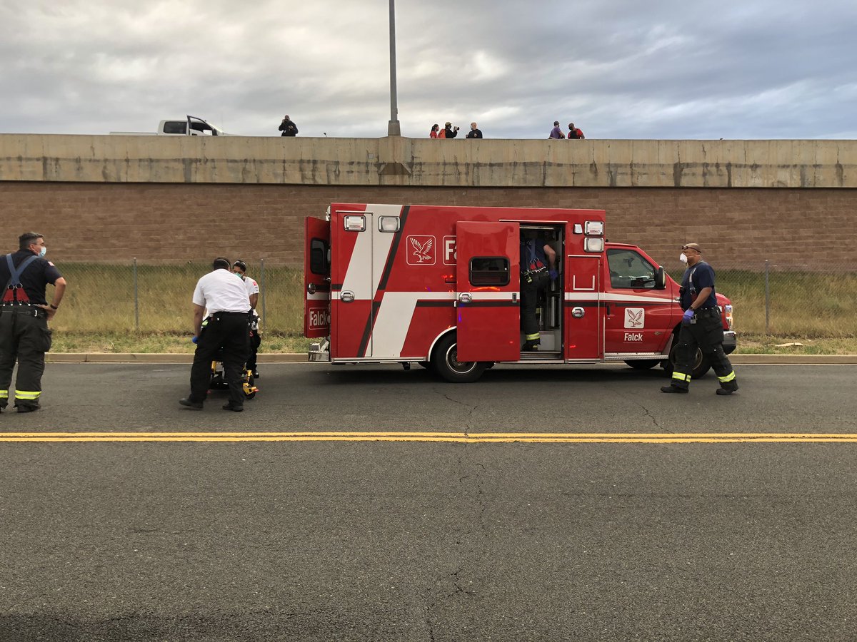 The young woman who fell off the highway has been taken away on a stretcher, in an ambulance. Very scary — she easily fell 20 feet, by my estimate — but I saw her breathing and talking.