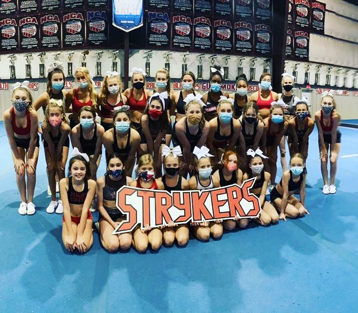 strykers_we's tweet photo. Our first official team picture with our Stryker sign! Take a second look 👀. You might see someone twice! #WoodlandsElite #Strykers #StrykeEmOut @WoodlandsCheer https://t.co/gNBWaoN2xs