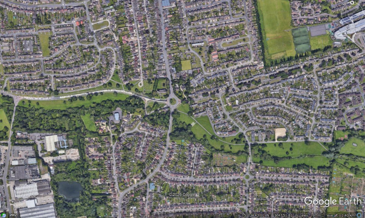The roundabout is in a part of Swindon called Rodbourne Cheney, a largely residential area to the north of the town. The church is called St Mary's. Here's a couple of Google Earth screenshots to set the scene, with the roundabout in the centre and north to the top. (3/24)