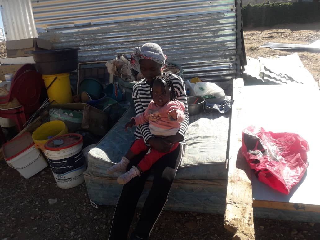 NewEraNewspaper's tweet photo. A family of five, including a one-year-old child, were forced to sleep in the open after the City of Windhoek demolished their shack. It is not yet clear as to what led to the demolition. The outraged community are demanding to be addressed by City Police chief Abraham Kanime. https://t.co/BrajkcuAGw