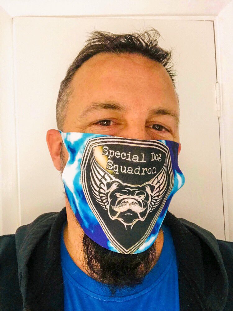 OfCanine's tweet photo. Nice to see the first SDS mask 😷,out in public, being used to help protect one another. 
(P.s. even the Squadron mask has trouble taming that beard 😬) 
.
#specialdogsquadron #dogs #doggo #book #books  #dog #facemask #terriersofinstagram  #bookworm  #read #bookish #booksforkids https://t.co/eXpQZywFwx