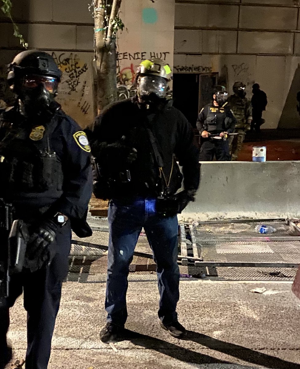 Just witnessed this guy on the Feds side snapping photos of multiple photographer’s press badges.  @Mrandyngo, is that you??  #PortlandProtest